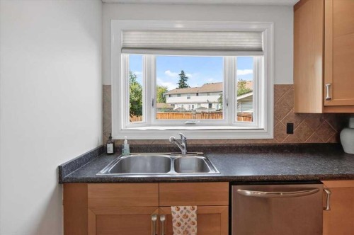 21 Woodhill Court Sw, Calgary, AB - Indoor Photo Showing Kitchen With Double Sink
