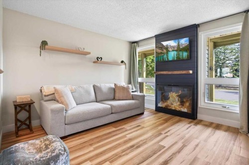 21 Woodhill Court Sw, Calgary, AB - Indoor Photo Showing Living Room With Fireplace