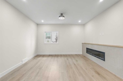 301-67 Panatella Square Nw, Calgary, AB - Indoor With Fireplace