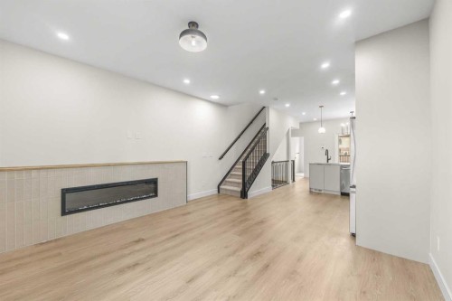 301-67 Panatella Square Nw, Calgary, AB - Indoor With Fireplace