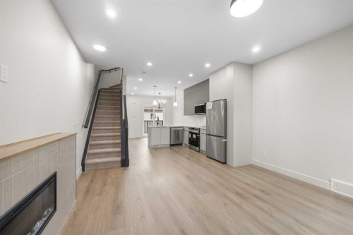 301-67 Panatella Square Nw, Calgary, AB - Indoor With Fireplace