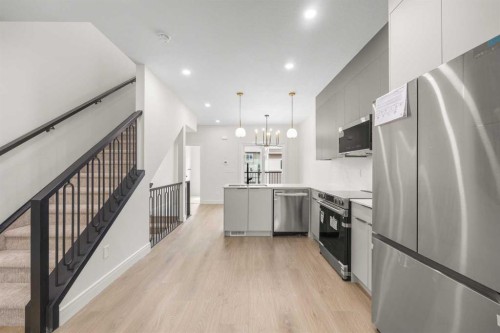 301-67 Panatella Square Nw, Calgary, AB - Indoor Photo Showing Kitchen With Stainless Steel Kitchen With Upgraded Kitchen