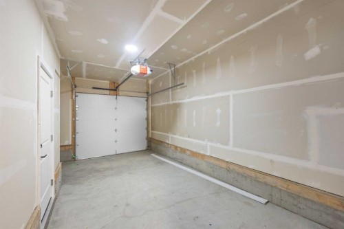 301-67 Panatella Square Nw, Calgary, AB - Indoor Photo Showing Garage