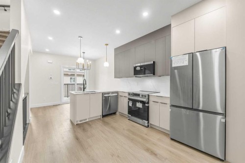 301-67 Panatella Square Nw, Calgary, AB - Indoor Photo Showing Kitchen With Stainless Steel Kitchen With Upgraded Kitchen