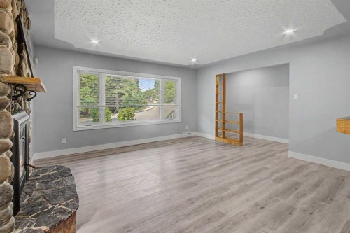 18 Collingwood Place Nw, Calgary, AB - Indoor Photo Showing Other Room With Fireplace