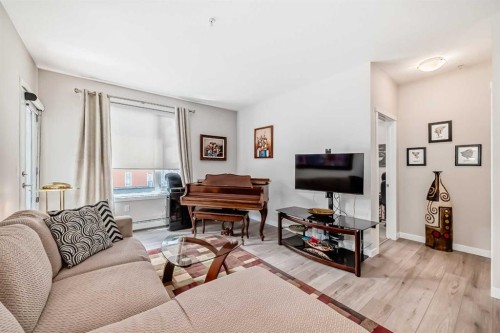 402-30 Shawnee Common Sw, Calgary, AB - Indoor Photo Showing Living Room
