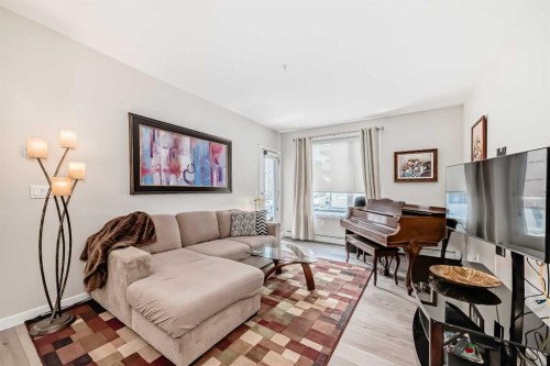 402-30 Shawnee Common Sw, Calgary, AB - Indoor Photo Showing Living Room