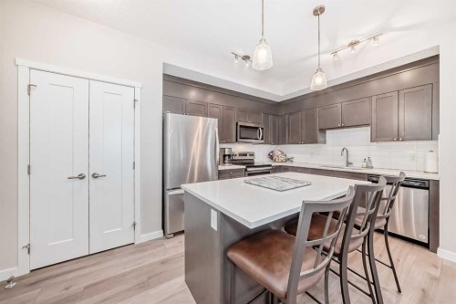402-30 Shawnee Common Sw, Calgary, AB - Indoor Photo Showing Kitchen With Stainless Steel Kitchen