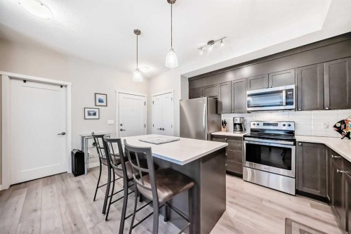 402-30 Shawnee Common Sw, Calgary, AB - Indoor Photo Showing Kitchen With Stainless Steel Kitchen With Upgraded Kitchen