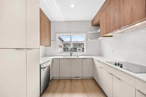 302-67 Panatella Square Nw, Calgary, AB - Indoor Photo Showing Kitchen