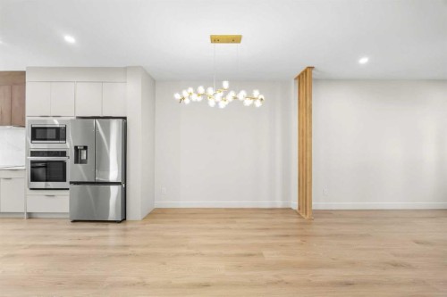 302-67 Panatella Square Nw, Calgary, AB - Indoor Photo Showing Kitchen With Stainless Steel Kitchen