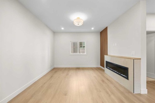 302-67 Panatella Square Nw, Calgary, AB - Indoor With Fireplace