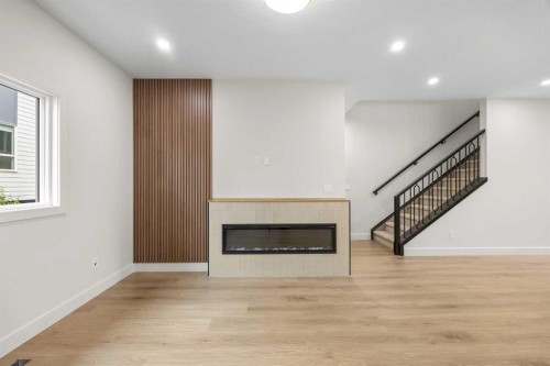302-67 Panatella Square Nw, Calgary, AB - Indoor With Fireplace