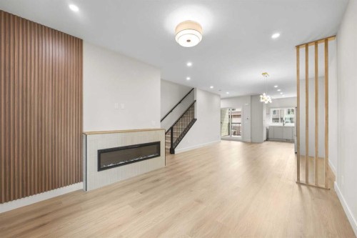 302-67 Panatella Square Nw, Calgary, AB - Indoor With Fireplace