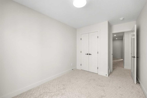 302-67 Panatella Square Nw, Calgary, AB - Indoor Photo Showing Other Room