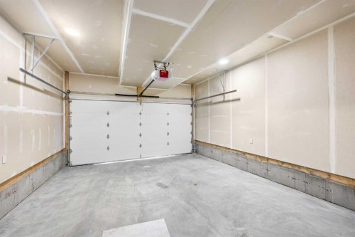 302-67 Panatella Square Nw, Calgary, AB - Indoor Photo Showing Garage