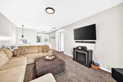 265 Bridleridge View Sw, Calgary, AB - Indoor Photo Showing Living Room
