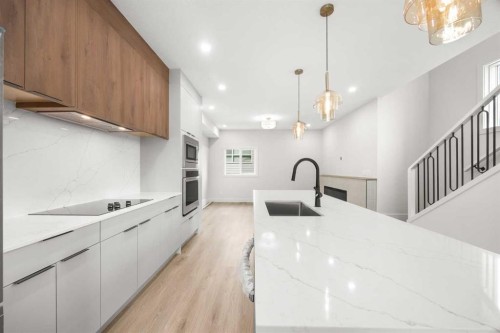 305-67 Panatella Square Nw, Calgary, AB - Indoor Photo Showing Kitchen With Upgraded Kitchen