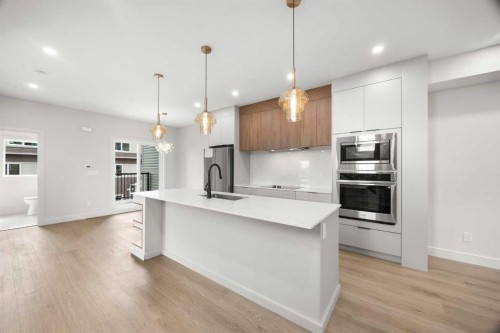305-67 Panatella Square Nw, Calgary, AB - Indoor Photo Showing Kitchen With Stainless Steel Kitchen With Upgraded Kitchen
