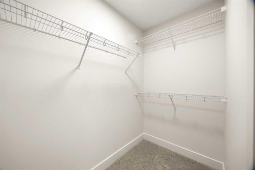 305-67 Panatella Square Nw, Calgary, AB - Indoor With Storage
