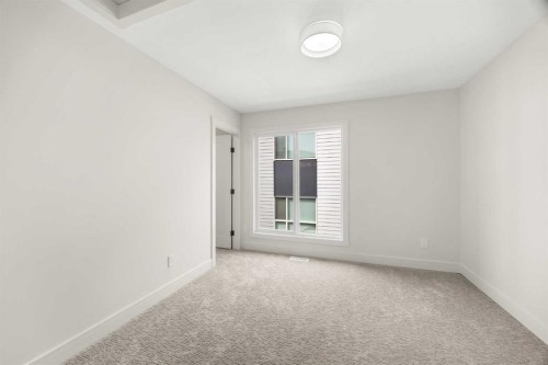 305-67 Panatella Square Nw, Calgary, AB - Indoor Photo Showing Other Room