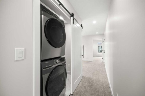 305-67 Panatella Square Nw, Calgary, AB - Indoor Photo Showing Laundry Room