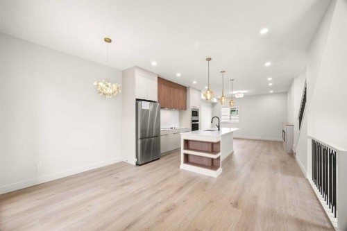 305-67 Panatella Square Nw, Calgary, AB - Indoor Photo Showing Kitchen With Stainless Steel Kitchen With Upgraded Kitchen