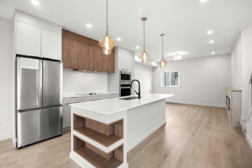 305-67 Panatella Square Nw, Calgary, AB - Indoor Photo Showing Kitchen With Stainless Steel Kitchen With Upgraded Kitchen