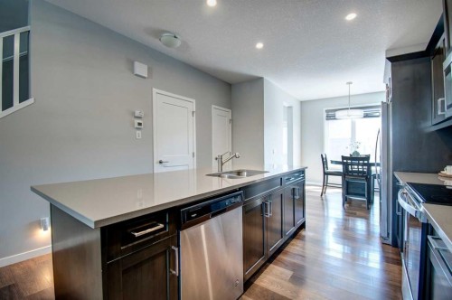 261 Ellen Way, Crossfield, AB - Indoor Photo Showing Kitchen With Double Sink With Upgraded Kitchen