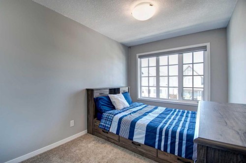 261 Ellen Way, Crossfield, AB - Indoor Photo Showing Bedroom