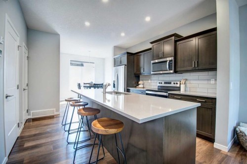 261 Ellen Way, Crossfield, AB - Indoor Photo Showing Kitchen With Upgraded Kitchen
