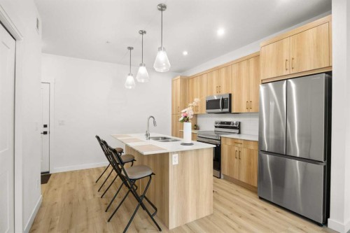 2104-55 Lucas Way Nw, Calgary, AB - Indoor Photo Showing Kitchen With Stainless Steel Kitchen