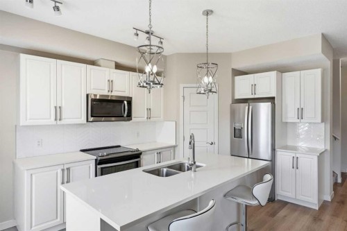 308-32 Red Embers Parade Ne, Calgary, AB - Indoor Photo Showing Kitchen With Stainless Steel Kitchen With Double Sink With Upgraded Kitchen