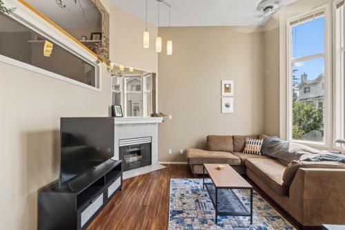 623 Hawkstone Manor Nw, Calgary, AB - Indoor Photo Showing Living Room With Fireplace