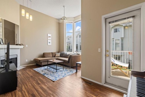 623 Hawkstone Manor Nw, Calgary, AB - Indoor Photo Showing Living Room With Fireplace