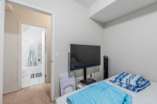 65 Martinvalley Road Ne, Calgary, AB - Indoor Photo Showing Bedroom