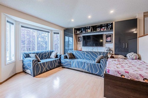 65 Martinvalley Road Ne, Calgary, AB - Indoor Photo Showing Bedroom