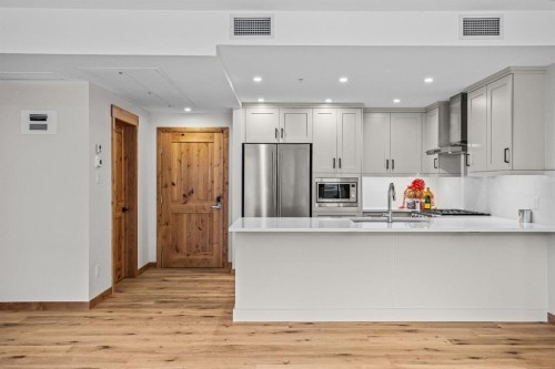 108-1606 Spring Creek Gate, Canmore, AB - Indoor Photo Showing Kitchen