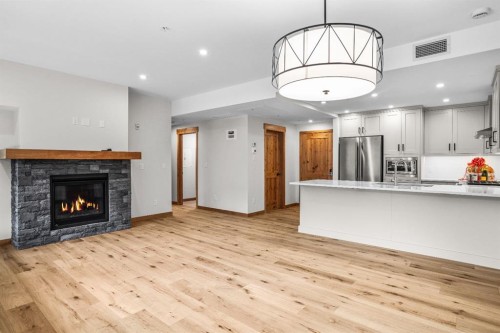 108-1606 Spring Creek Gate, Canmore, AB - Indoor With Fireplace