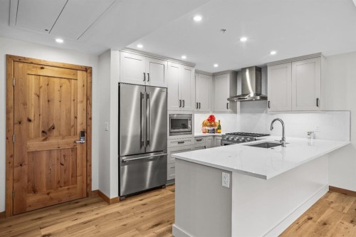 108-1606 Spring Creek Gate, Canmore, AB - Indoor Photo Showing Kitchen With Upgraded Kitchen