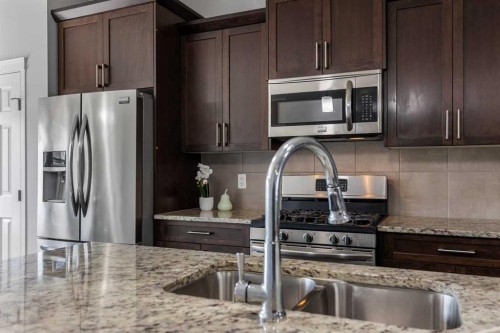 51 Walgrove Terrace Se, Calgary, AB - Indoor Photo Showing Kitchen With Stainless Steel Kitchen With Double Sink With Upgraded Kitchen