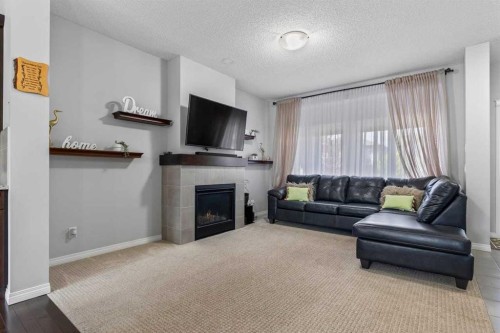 51 Walgrove Terrace Se, Calgary, AB - Indoor Photo Showing Living Room With Fireplace