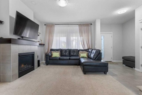 51 Walgrove Terrace Se, Calgary, AB - Indoor Photo Showing Living Room With Fireplace