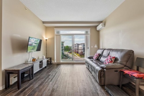 1403-450 Sage Valley Drive Nw, Calgary, AB - Indoor Photo Showing Living Room