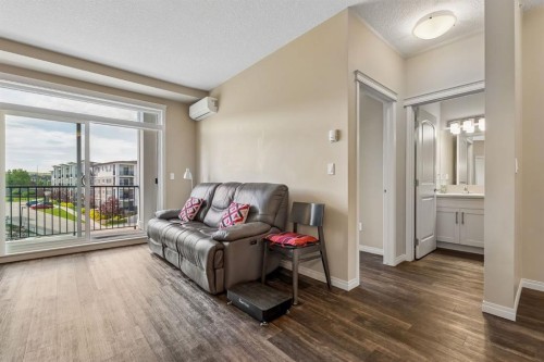 1403-450 Sage Valley Drive Nw, Calgary, AB - Indoor Photo Showing Living Room