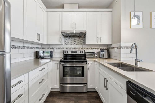 1403-450 Sage Valley Drive Nw, Calgary, AB - Indoor Photo Showing Kitchen With Stainless Steel Kitchen With Double Sink With Upgraded Kitchen