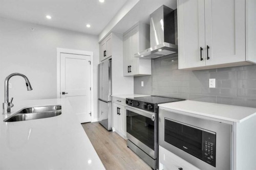 6412-200 Seton Circle Se, Calgary, AB - Indoor Photo Showing Kitchen With Stainless Steel Kitchen With Double Sink With Upgraded Kitchen