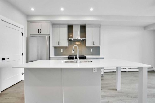 6412-200 Seton Circle Se, Calgary, AB - Indoor Photo Showing Kitchen With Double Sink With Upgraded Kitchen