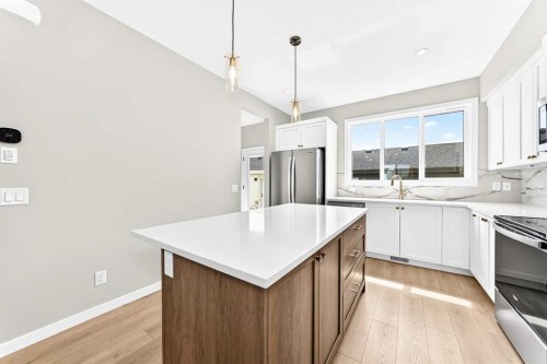 277 Heirloom Way Se, Calgary, AB - Indoor Photo Showing Kitchen With Double Sink With Upgraded Kitchen