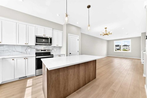 277 Heirloom Way Se, Calgary, AB - Indoor Photo Showing Kitchen With Upgraded Kitchen